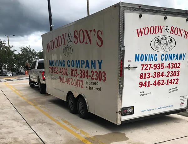 Woody & Sons Moving logo